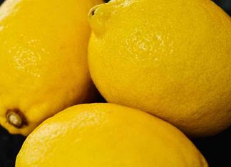 An up-close photo of pile of three lemons