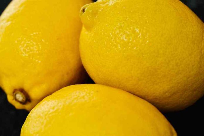 An up-close photo of pile of three lemons