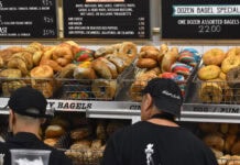 Baskets of bagels line the wall of an NYC deli