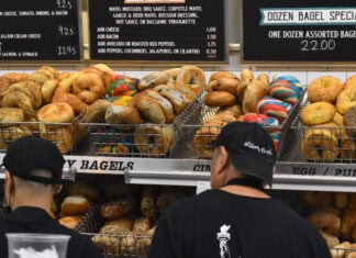 Baskets of bagels line the wall of an NYC deli