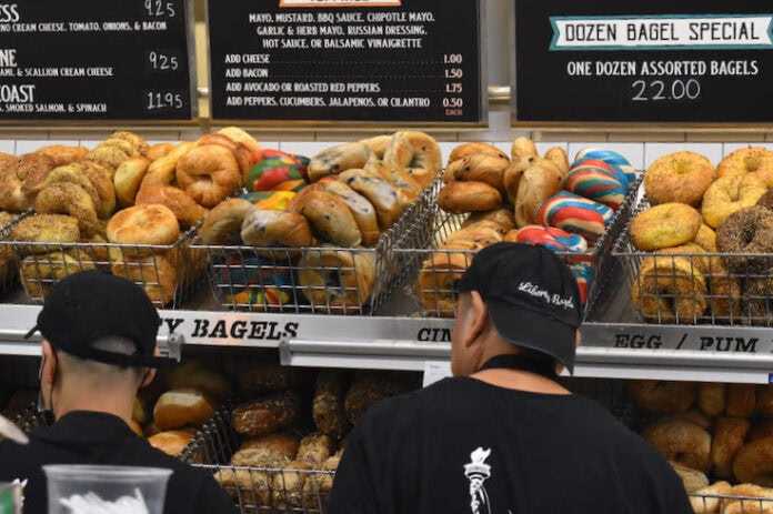 Baskets of bagels line the wall of an NYC deli