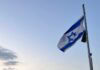 An Israeli flag at sunrise.