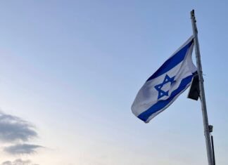 An Israeli flag at sunrise.